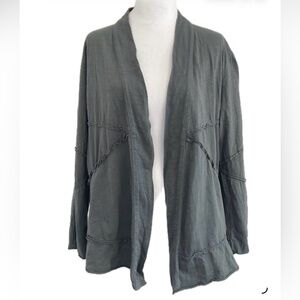 **Neon Buddha Olive Cotton Cape with exposed seams .